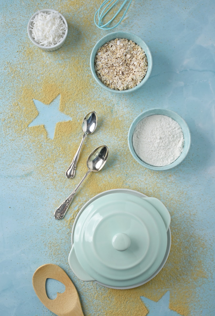 A table topped with bowls of food and utensils
